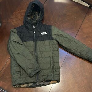 Reversible camp/olive-green & black North Face puffer jacket